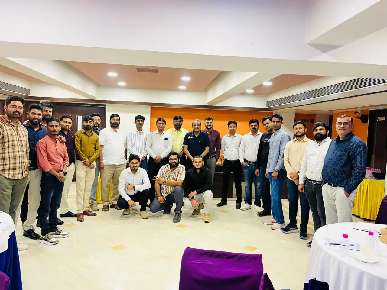 NIST Global BBS safety programme — group of industrial workers and EHS professionals in a BBS training workshop