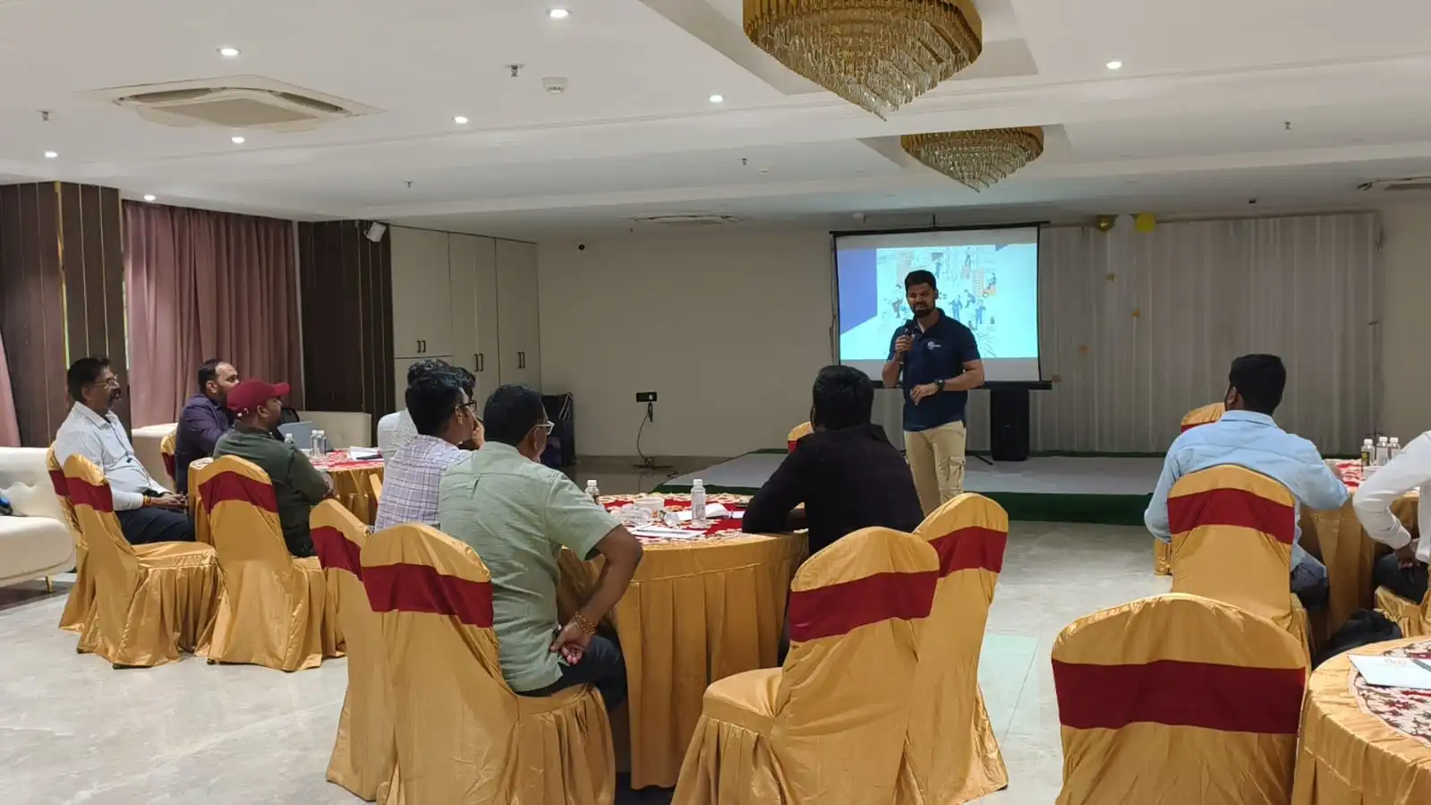 NIST Global Behaviour Based Safety training — trainer conducting hands-on BBS observation session at a facility in India